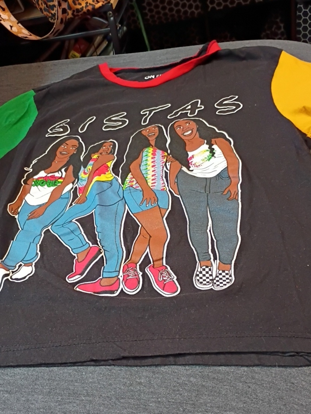 On Fire Black 'Sistas' Graphic Tee with Green and Yellow Sleeves